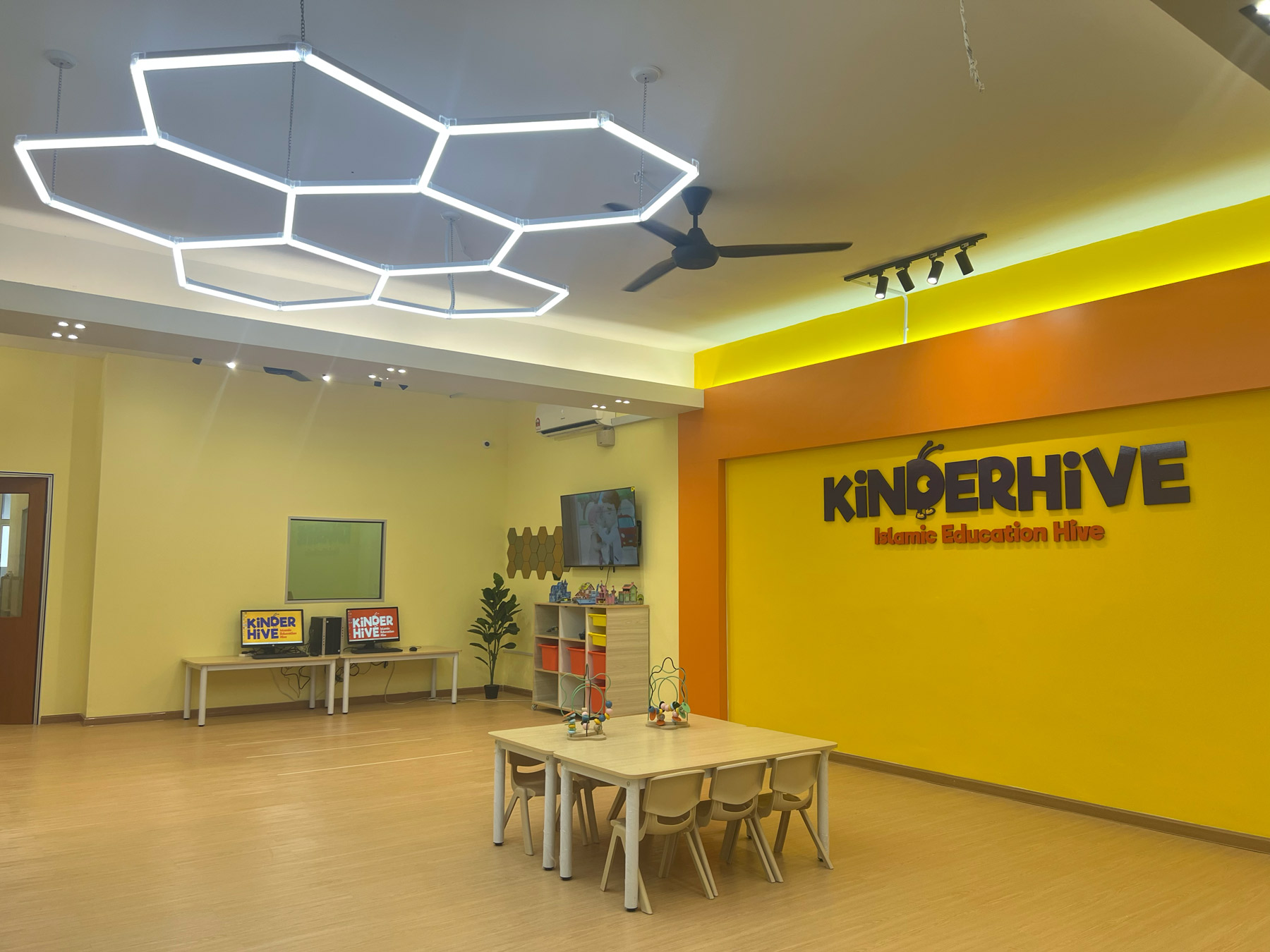 KinderHive Islamic preschool classroom with kids’ tables and learning area