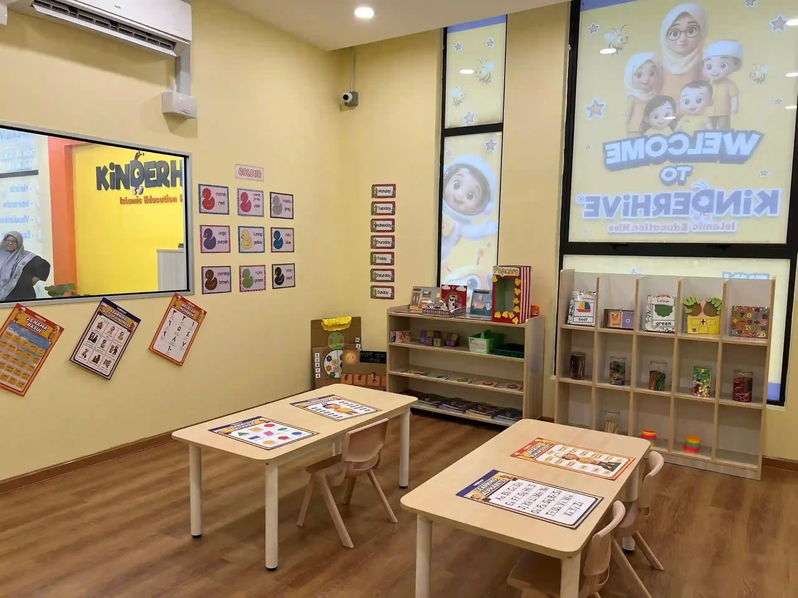 KinderHive Islamic preschool classroom with learning corners and activity tables