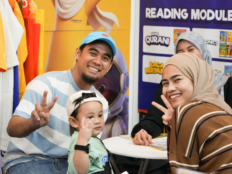 Family visiting the KinderHive booth during ECEE 2026 at IDCC Shah Alam