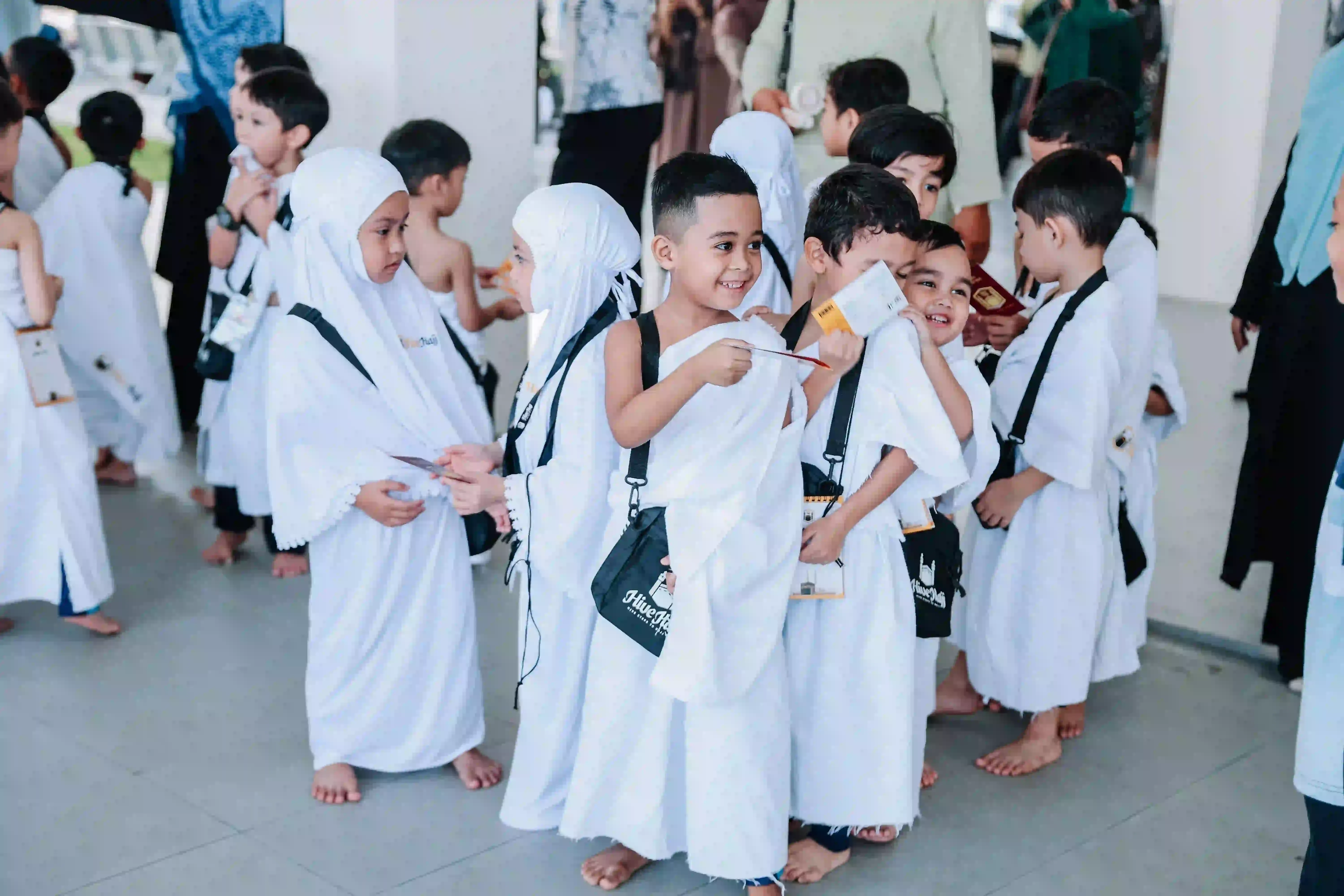KinderHive preschool children in ihram outfits during Islamic learning activity